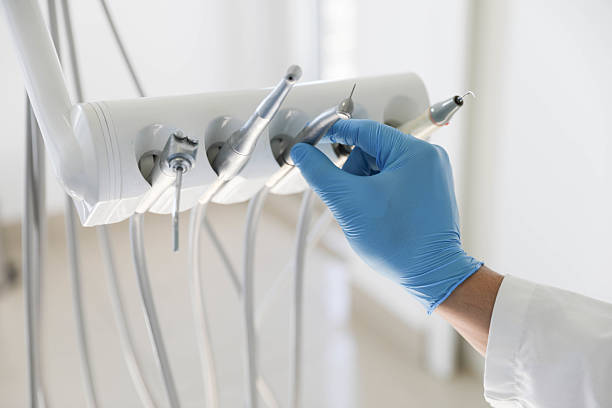 Professional Tooth Extraction technician working in Ames, IA